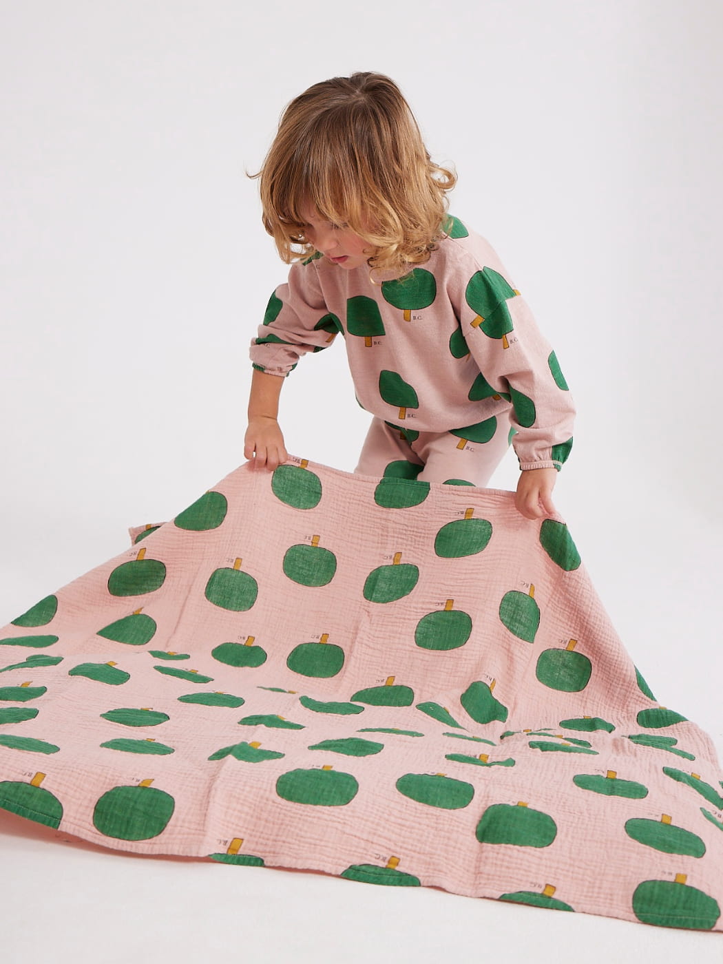 Bobo Choses muslin swaddle with trees on it