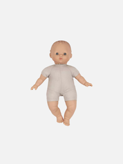 Baby doll wearing a beige onesie on a white background