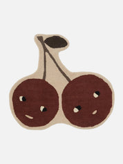 Rug shaped like a pair of cherries on a white background