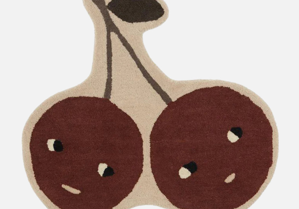 Rug shaped like a pair of cherries on a white background